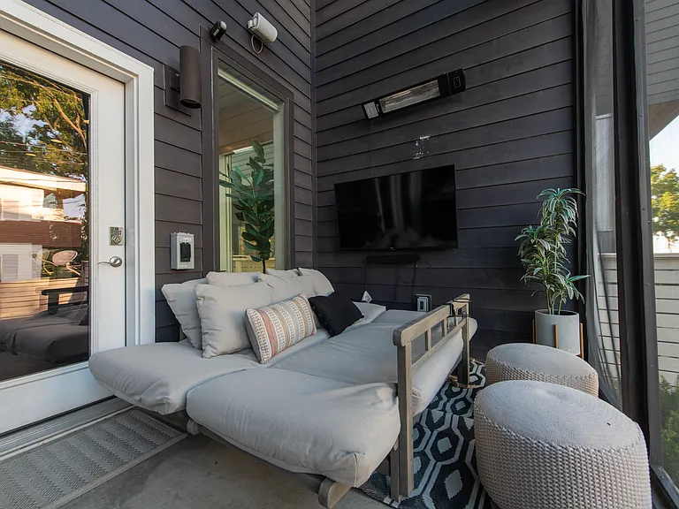 Another view of the Screened in back porch, with TV, Soundbar, and Infrared Heater