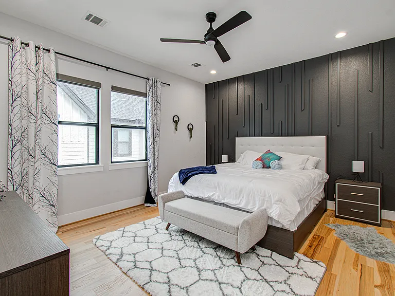 Spacious primary suite with a king bed, brand-new furniture, and a new mattress. Blackout curtains and blinds provide excellent light control, while the quiet neighborhood offers a peaceful setting for restful sleep day or night.