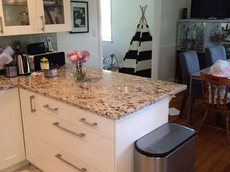 Breakfast bar next to kitchin and dining