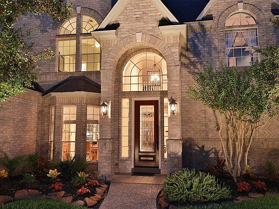 UNIQUE ALL BRICK HOME IN HIGHLY DESIRABLE LOCATION - Custom 2-story 4 bedroom home, 3.5 baths, 3 living areas and covered patio! As you step inside - you will notice how crisp, clean & how well-kept this house is. Solid wood Traditional door with des