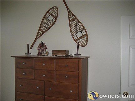 Dresser in Master Bedroom with snow shoes on wall