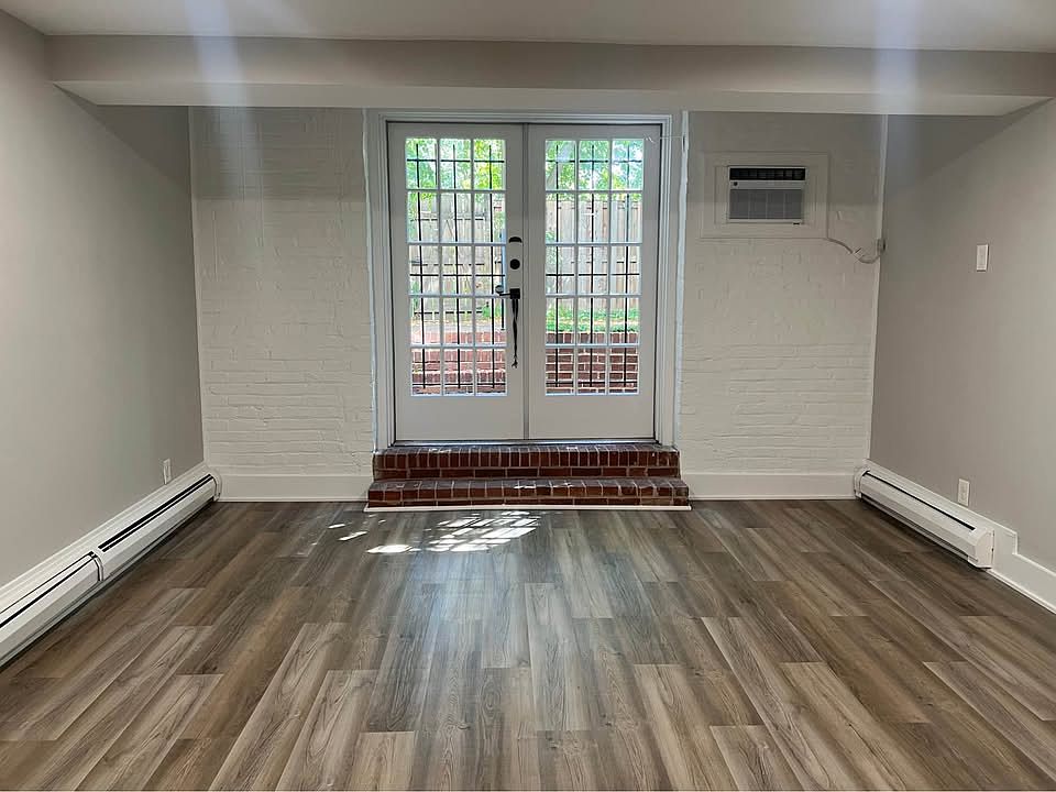 Living room with french doors opening to private backyard