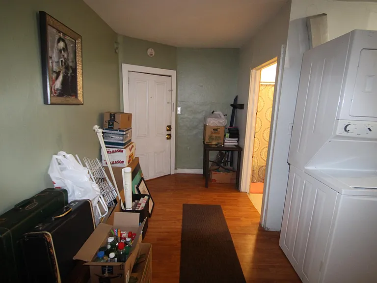 eating area by kitchen and bathroom (front door)
