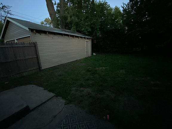 Side of the garage and back yard