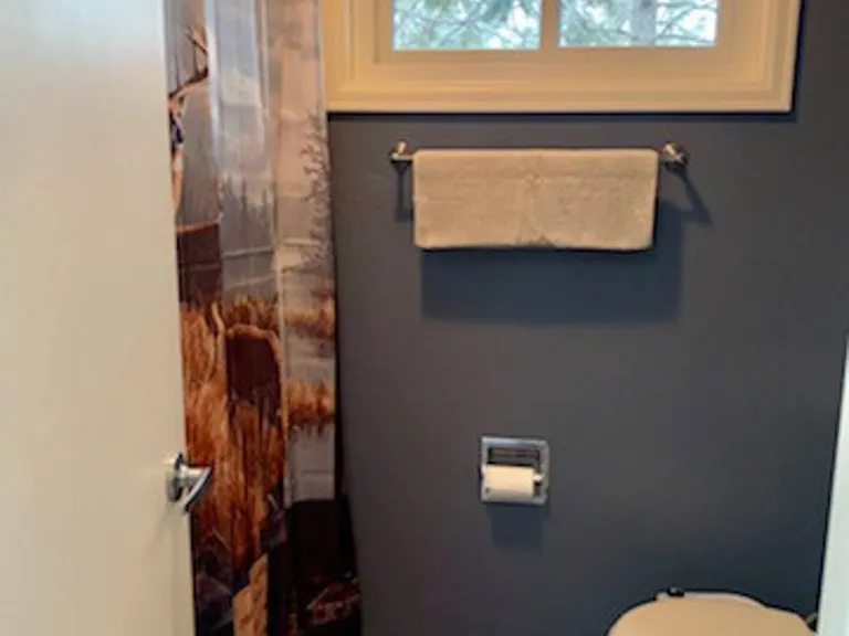 Full bathroom with seperate room for for toilet in master suite
