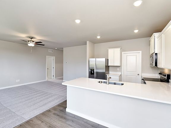 A spacious breakfast bar is the perfect spot for a quick meal.