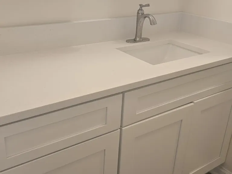 New vanity, faucet and cabinet with stone countertops