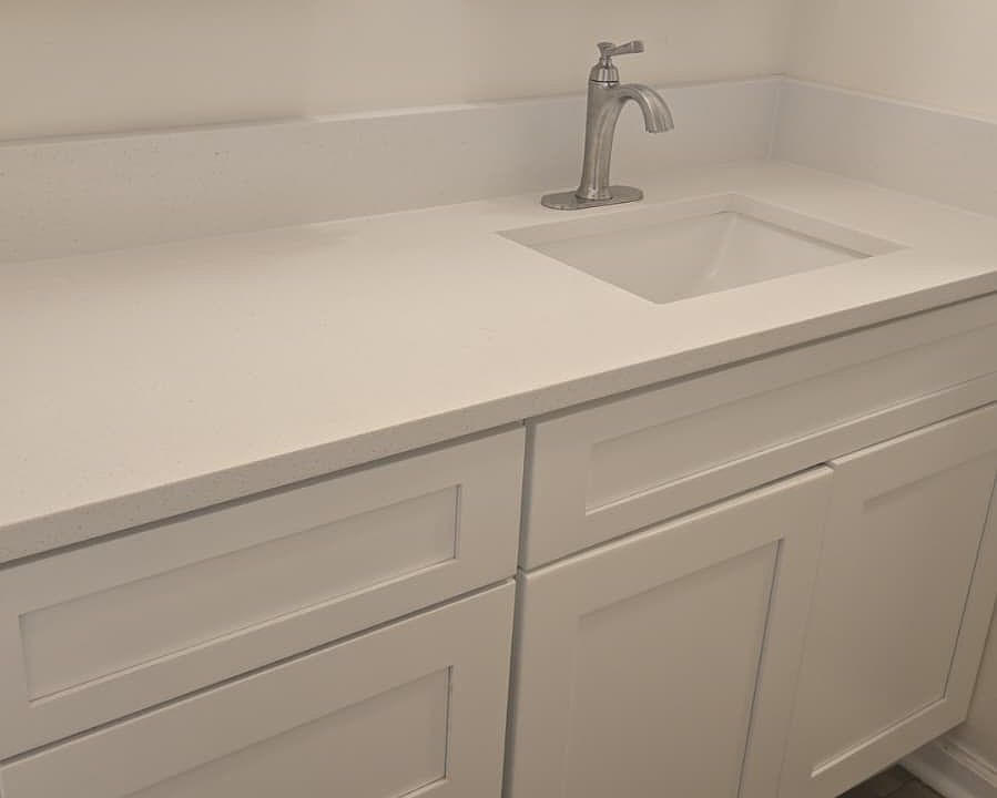 New vanity, faucet and cabinet with stone countertops