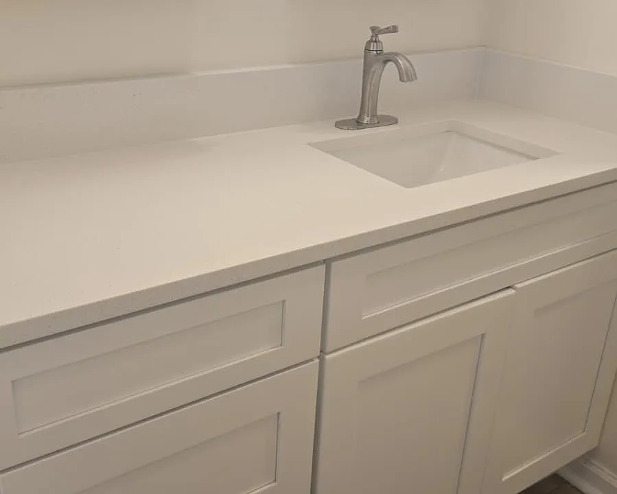 New vanity, faucet and cabinet with stone countertops
