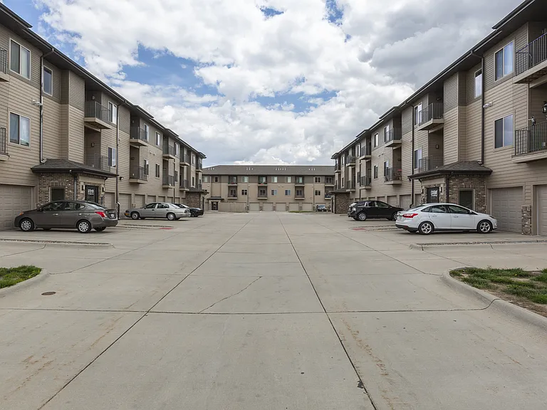 Apartment buildings with garages attached at The Sterling Grand Island
