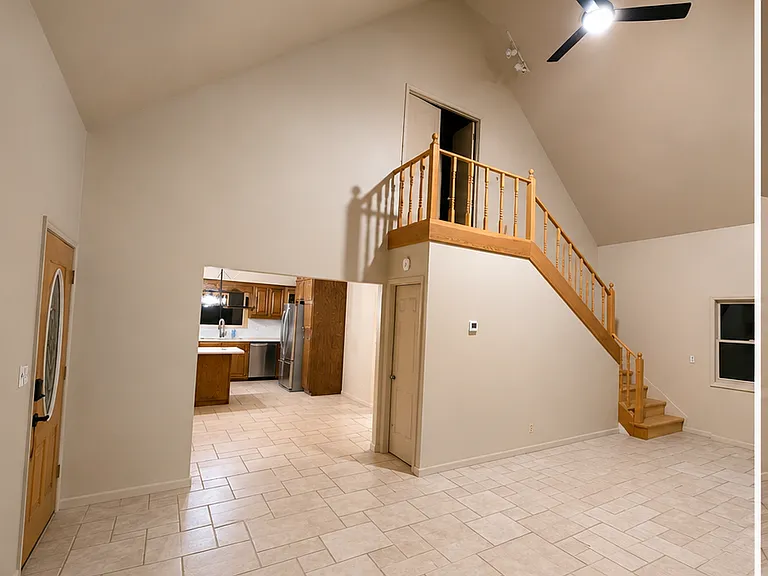 Living room facing dining room and kitchen.