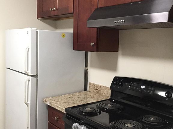 New Kitchen Cabinets, New granite countertops, New oven.