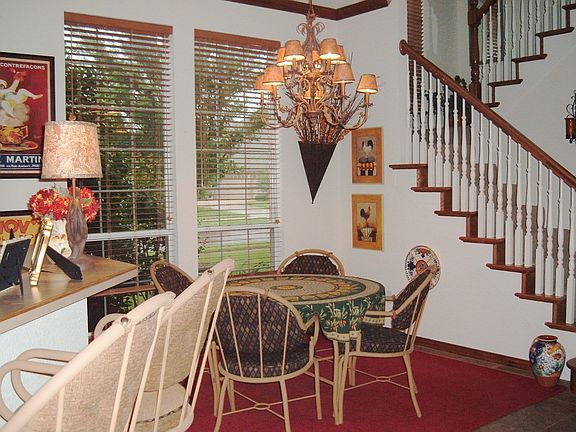 BREAKFAST AREA AND STAIRWAY TO UPPER LEVEL