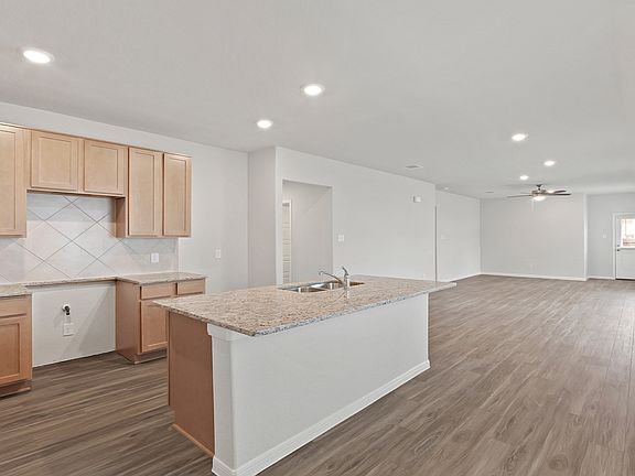 Kitchen to Dining Area and Family Room