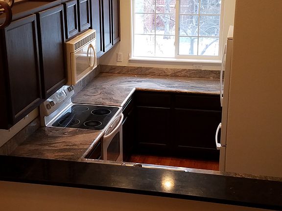 Kitchen, leather finish granite breakfast bar.
