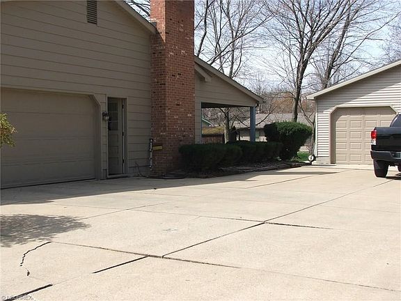 in addition to two car attached garage, there is an oversized detached two car garage.