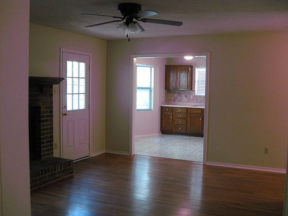 Living room opens to Kitchen