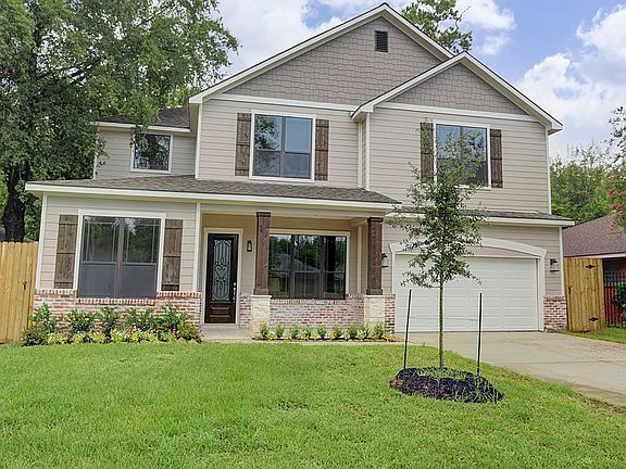 This gorgeous Oak Forest home features a double wide driveway and HUGE backyard