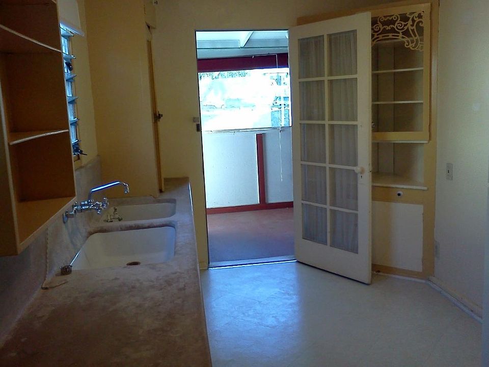 Original poured concrete countertops. Lovely, original built-in. No disposal or dishwasher.