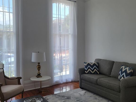 Living room with pull out couch, newly renovated with mostly new furnishings.