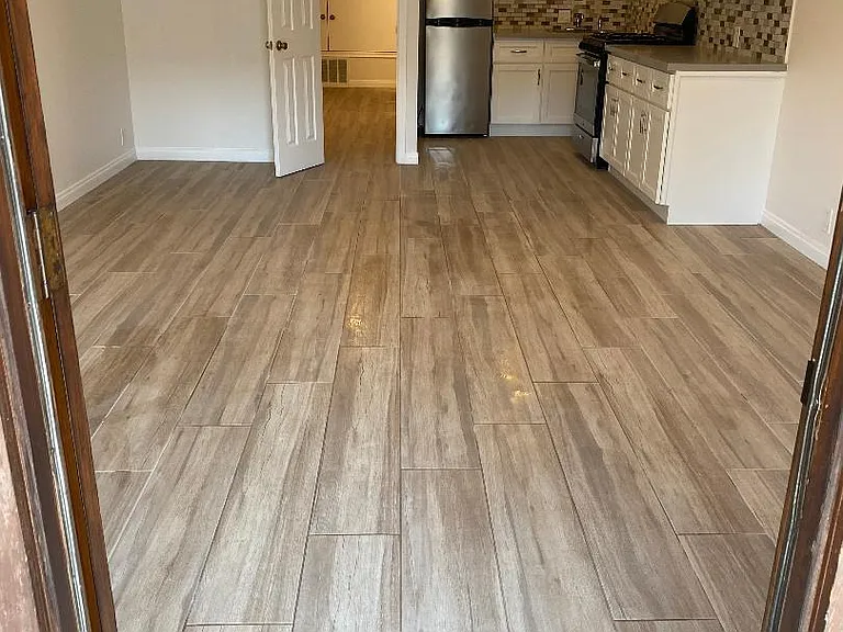 Living/Dining and Kitchen area; Porcelain tile flooring throughout