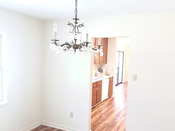 View of dining room, kitchen and into the family room, from the hall