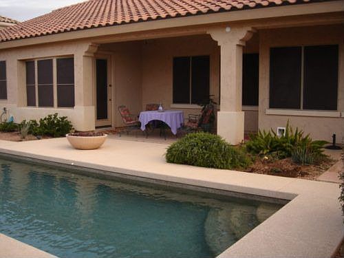 Covered back patio with gas fire pit