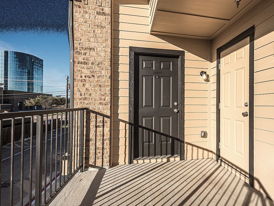 View of exterior entry featuring a balcony
