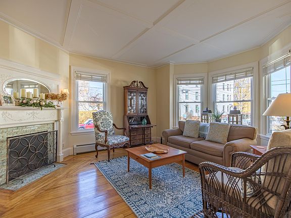 Windows, fireplace and detailed ceilings.