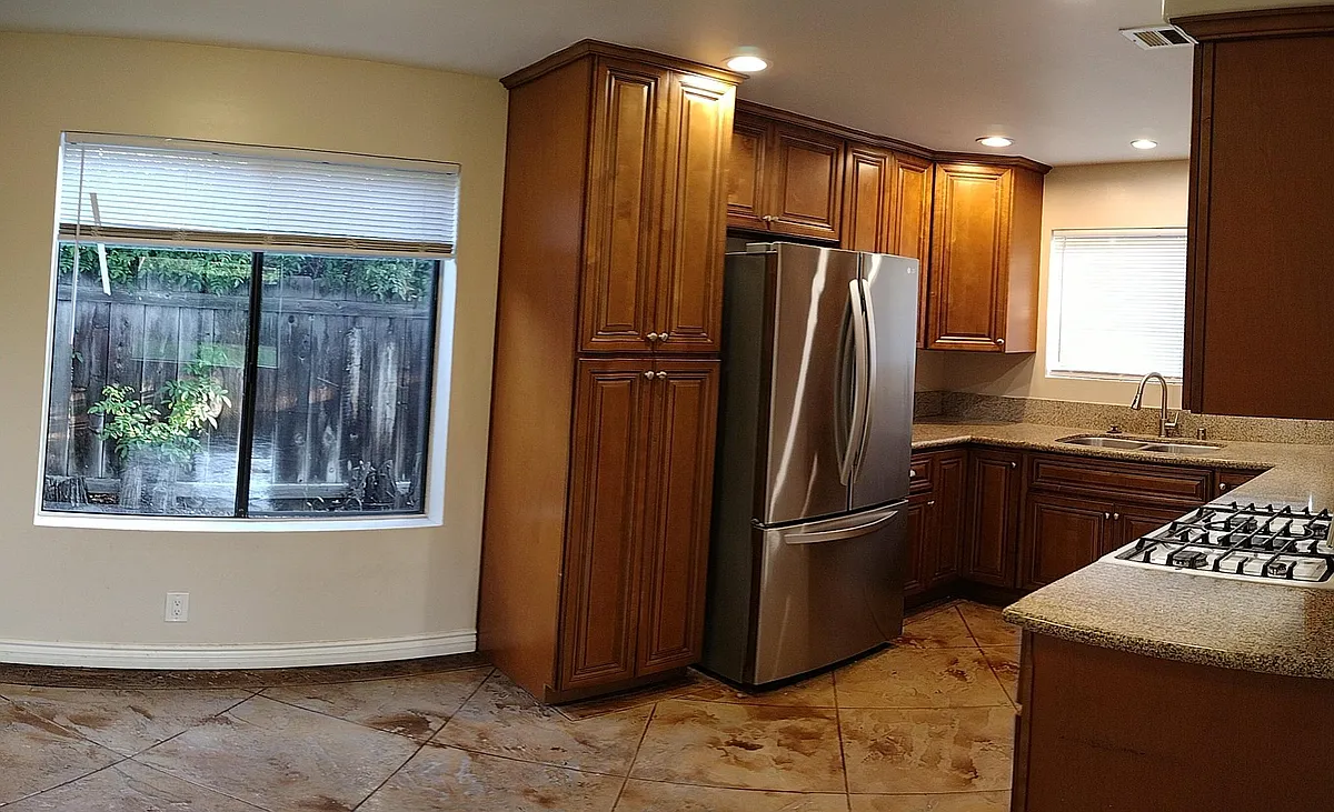 Beautiful kitchen with newer cabinets and newer stainless fridge. - 4720-24 63rd St #3