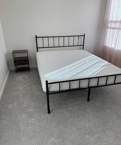 Bed, nightstand and Window