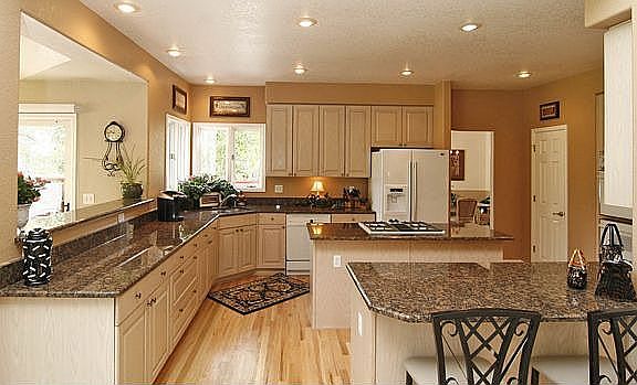 Fabulous kitchen!  Slab granite, gas cooktop island!