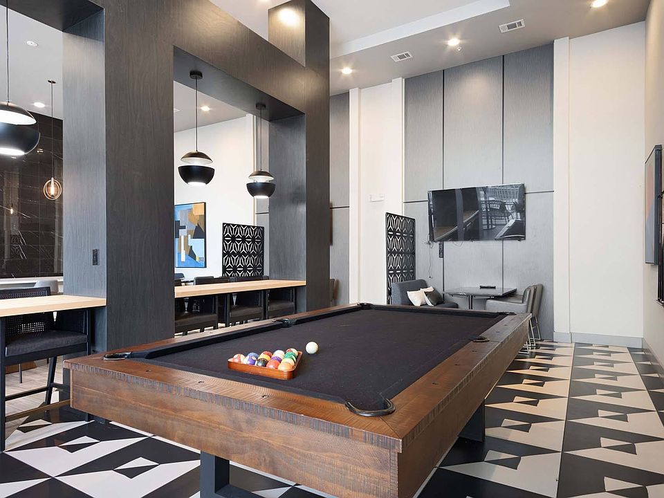 Unleash your competitive side with a game of pool in the lounge, perfect for fun and friendly matches.