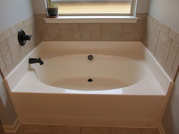 Tub w/ tile & Bronze accents