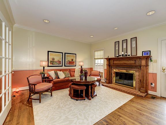Family room with hardwood floors, crown molding, and gas fireplace
