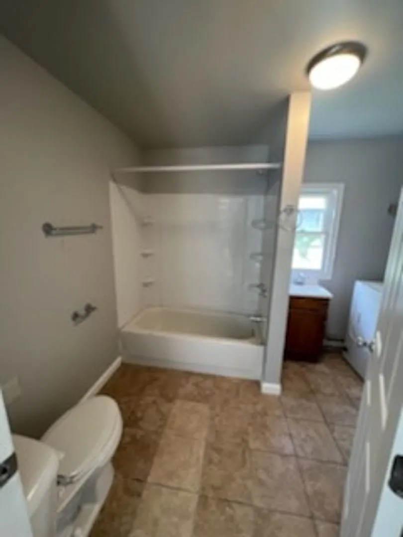 Charming 4-Bedroom, 2-Bath Home with Spacious Living Areas — Photo 4