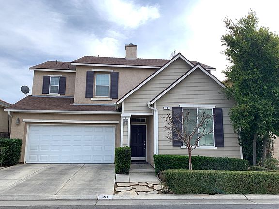 Front of home from the curb. Attached 2-car garage.