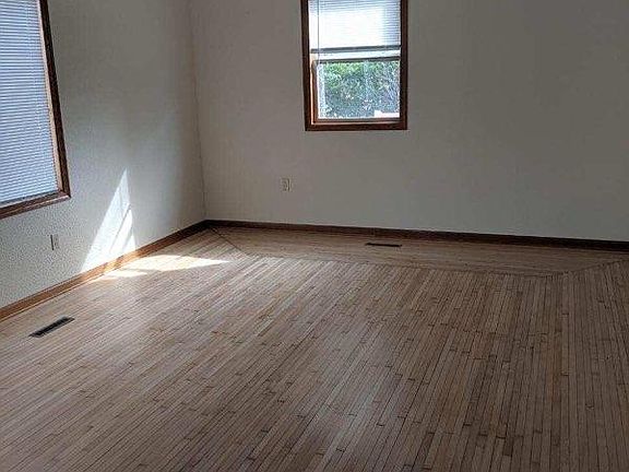 Large living room with refinished wood floor