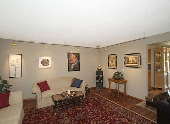 In the sunken living room, lighting is designed to highlight you