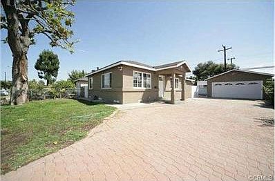 Long driveway to the 2-car garage