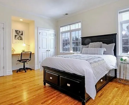 Bedroom 4 with double closets, built-in desk and full bath en suite.