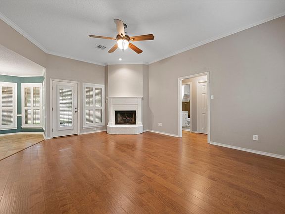 A wood-burning fireplace adds character to the main living space