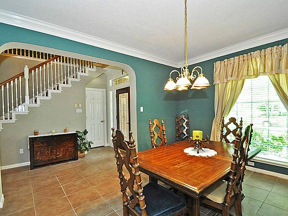 FORMAL DINING OFF FOYER WITH ARCHED DOORWAYS