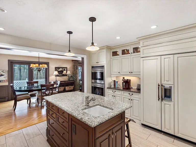 Custom kitchen with double ovens.