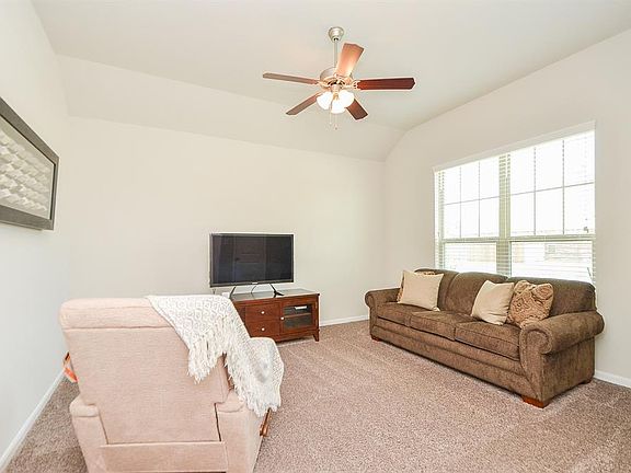 With ample space for a shelving unit or bookshelves, this room is perfect for an executive office, sitting area, or well-appointed craft room.