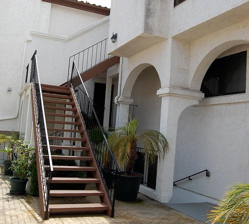 Stairs leading from the private/gated courtyard to the unit's front door.