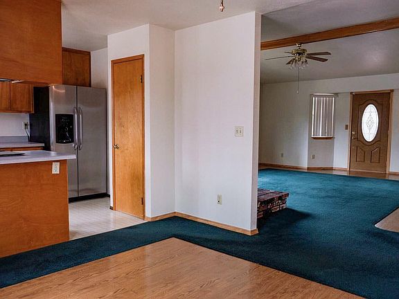 Dining room looking into kitchen and living room