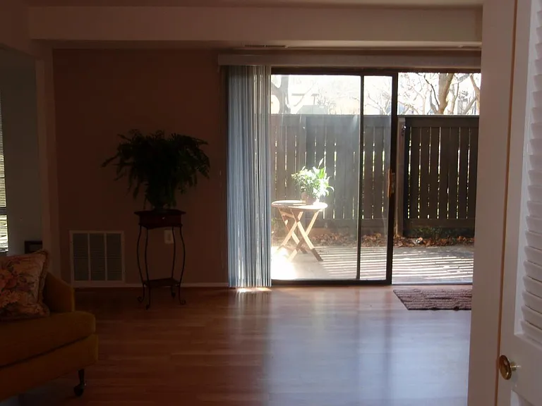 Living room to patio. Photo was taken late afternoon. The condo has a lot of natural light from dawn to 4pm.