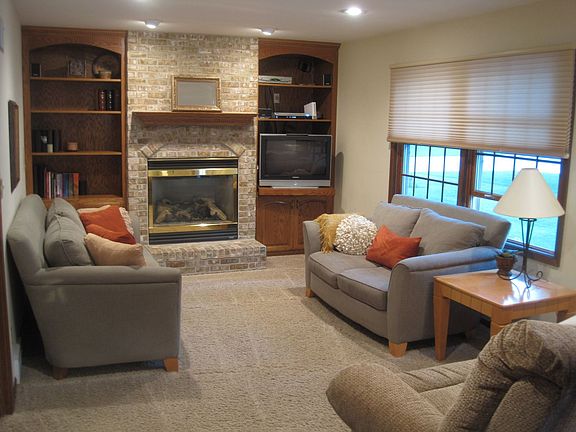 Gas FP in Family Room, Custom Oak Cabinetry & Lighting