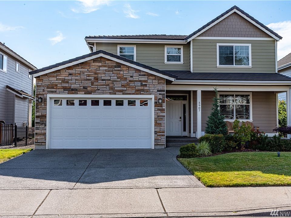 Exterior of Hardi Plank and Stone. Garage Size: 21' Long 19' Wide with 8 Foot Door Accommodates 4 Door Full Sized Truck.